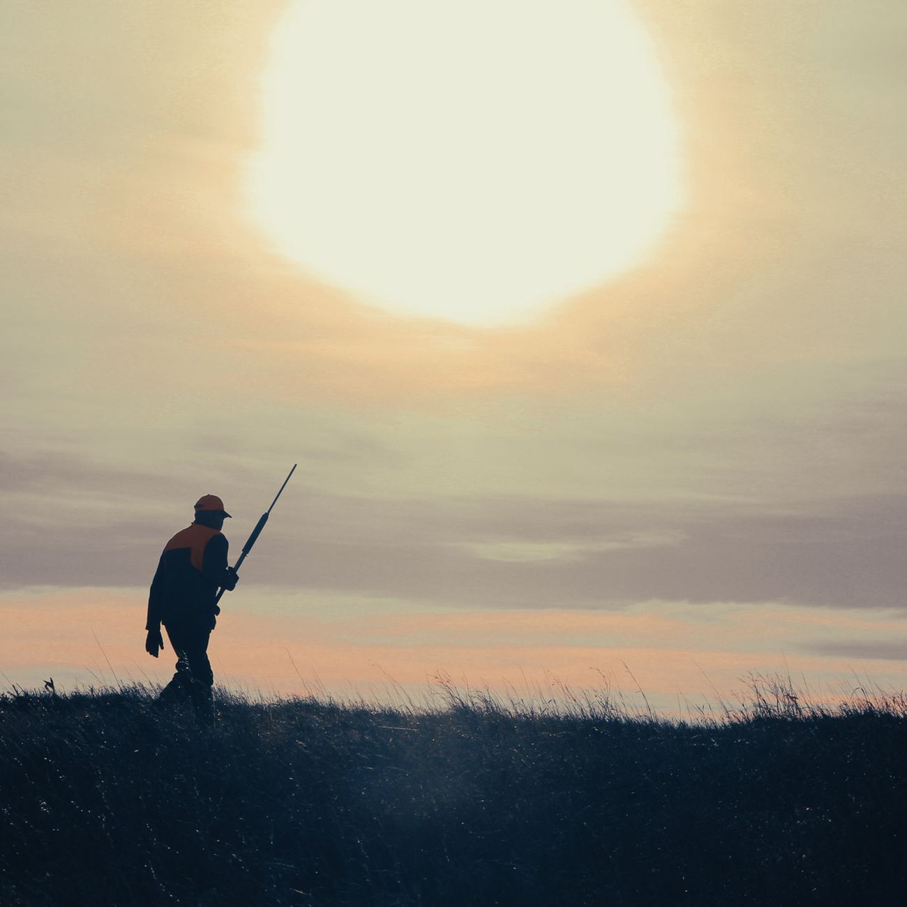 A hunter walking out at sunrise on Bolton Ranch